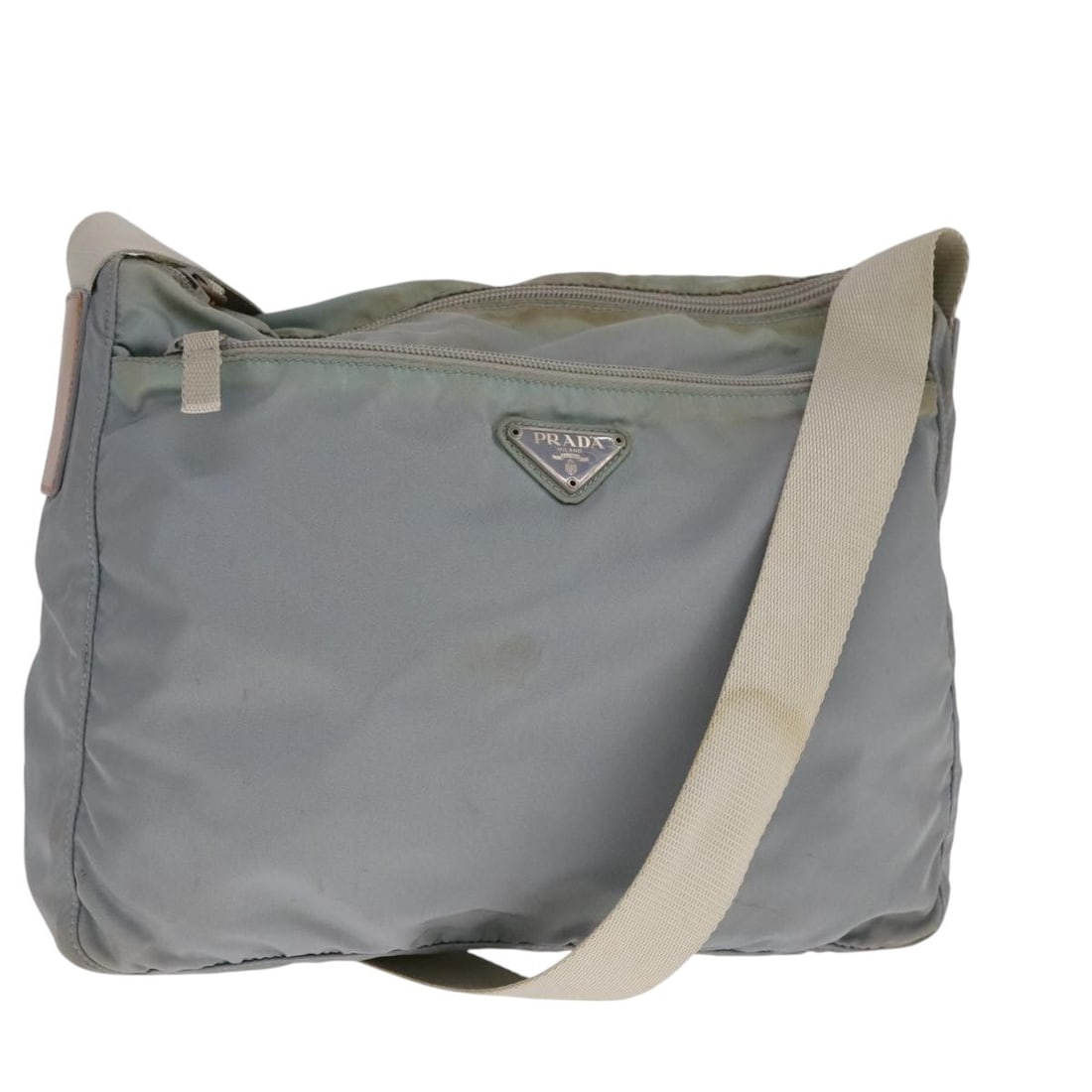 Light Blue Gray Silver Nylon PRADA Shoulder Bag for Women Italy: Light Blue Gray Silver Nylon PRADA Shoulder Bag for Women Italy This PRADA women's shoulder bag is crafted from nylon in light blue, gray, and silver tones. Made in Italy, the bag features an adjustab