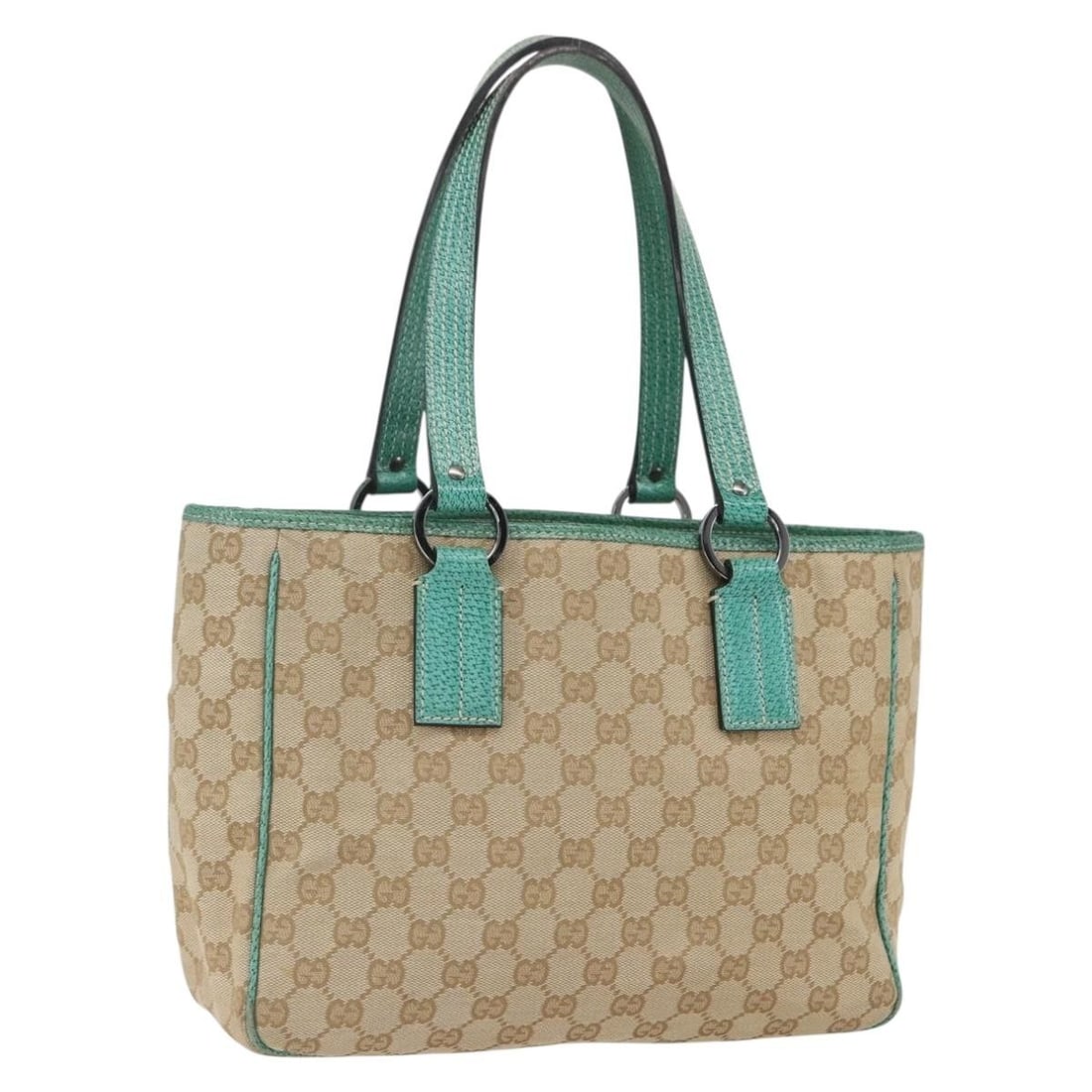 Beige Silver GG Canvas Tote by Gucci Model 113019 Italy: Beige Silver GG Canvas Tote by Gucci Model 113019 Italy This is an authentic Gucci GG Canvas tote bag in beige and silver tones. Crafted in Italy, the bag features the signature GG canvas exterior and