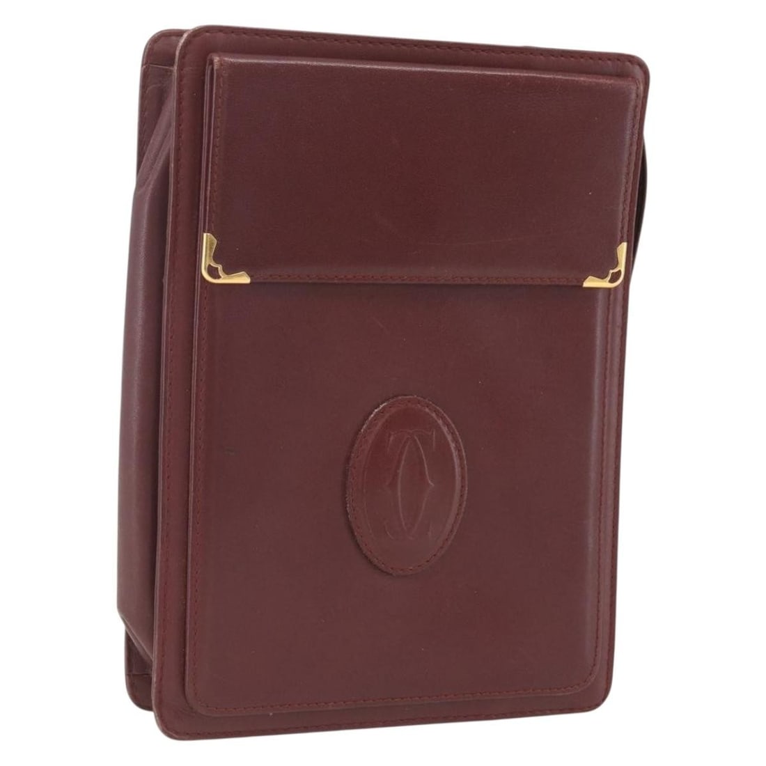 Must Line Bordeaux Leather Clutch by Cartier with Gold Accents: Must Line Bordeaux Leather Clutch by Cartier with Gold Accents This Cartier Must Line clutch bag is crafted from leather in a bordeaux and gold color combination. Made in Italy, it features a compact