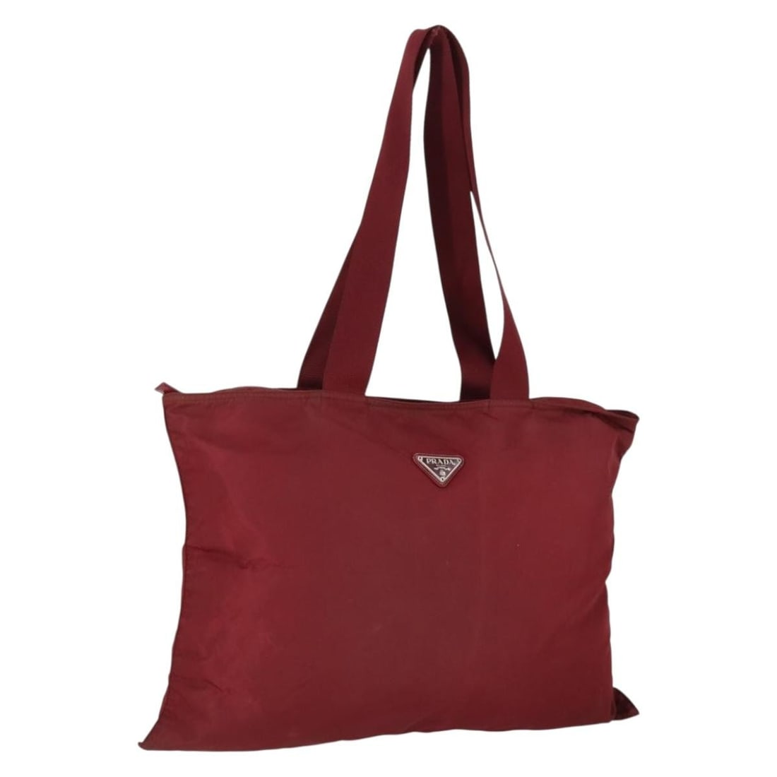 Red Nylon Shoulder Purse by PRADA Silver Accents Italy BA9935: Red Nylon Shoulder Purse by PRADA Silver Accents Italy BA9935 This PRADA shoulder bag is crafted from red nylon with silver-tone accents. It features a spacious interior and a comfortable shoulder str