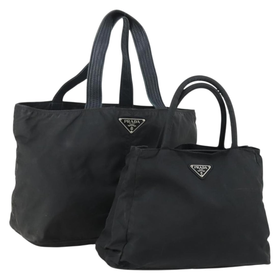 Black Nylon PRADA Tote Bag Two Piece Set from Italy: Black Nylon PRADA Tote Bag Two Piece Set from Italy This is a PRADA tote bag set crafted from black nylon. Designed in Italy, the bags feature a spacious tote style and are ideal for everyday use. The