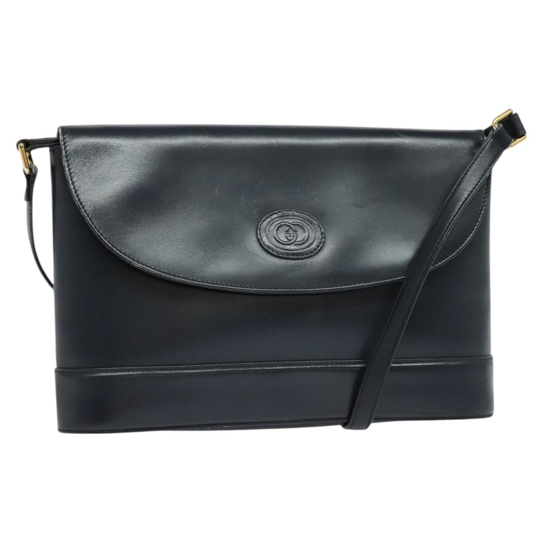 Navy Leather GUCCI Shoulder Bag with Gold Tone Accents Italy: Navy Leather GUCCI Shoulder Bag with Gold Tone Accents Italy This is a GUCCI women's shoulder bag crafted from navy leather with gold-tone accents. The bag features a shoulder strap with a drop length