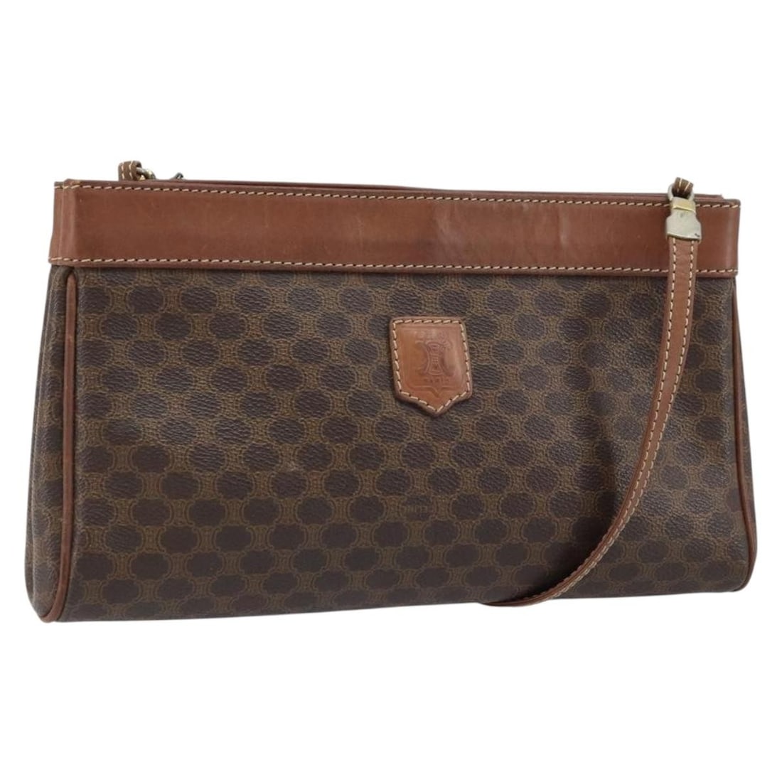 Brown PVC Leather Macadam Canvas Shoulder Bag by CELINE Gold Accents: Brown PVC Leather Macadam Canvas Shoulder Bag by CELINE Gold Accents This is a CELINE Macadam Canvas shoulder bag crafted from PVC leather in a brown and gold color scheme. The bag features a compact,