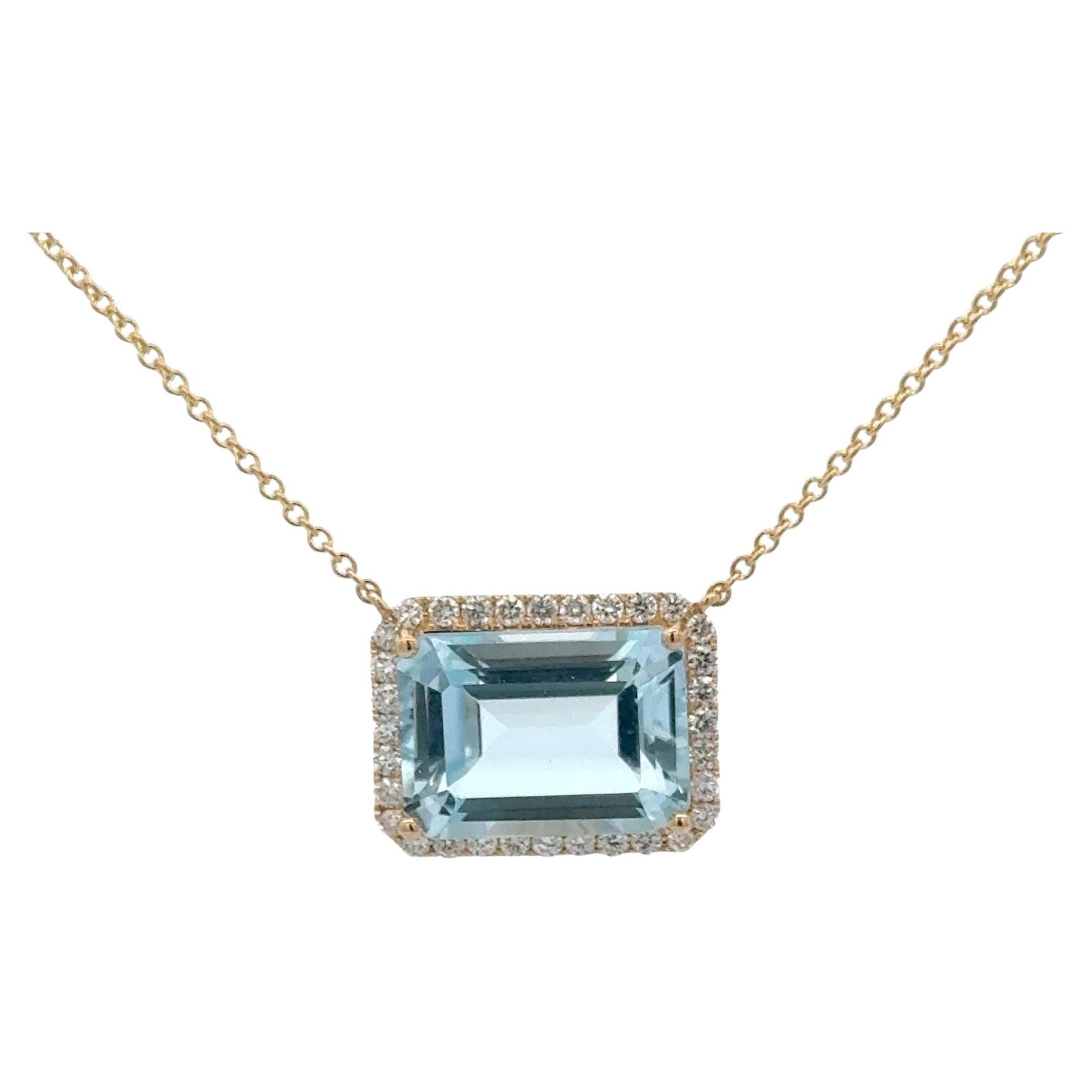 Harbor Diamonds Emerald Cut Sky Blue Topaz Pendant with Diamond Halo 14K Gold: Harbor Diamonds Emerald Cut Sky Blue Topaz Pendant with Diamond Halo 14K Gold This exquisite pendant showcases a stunning Emerald Cut Sky Blue Topaz weighing 9.72 carats, elegantly surrounded by a hal