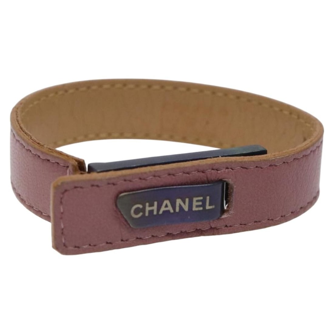 Purple Leather Bracelet by Chanel for Women Made in France: Purple Leather Bracelet by Chanel for Women Made in France This CHANEL bracelet features a purple leather exterior and is designed for women. The bracelet is crafted in France and showcases the iconic
