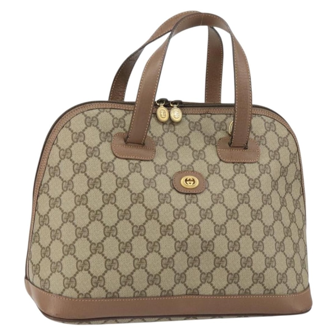 Beige Gold PVC GG Supreme Handbag by Gucci Italy: Beige Gold PVC GG Supreme Handbag by Gucci Italy This Gucci GG Supreme handbag features a beige and gold exterior crafted from PVC leather and GG canvas. The bag showcases a classic handbag style with