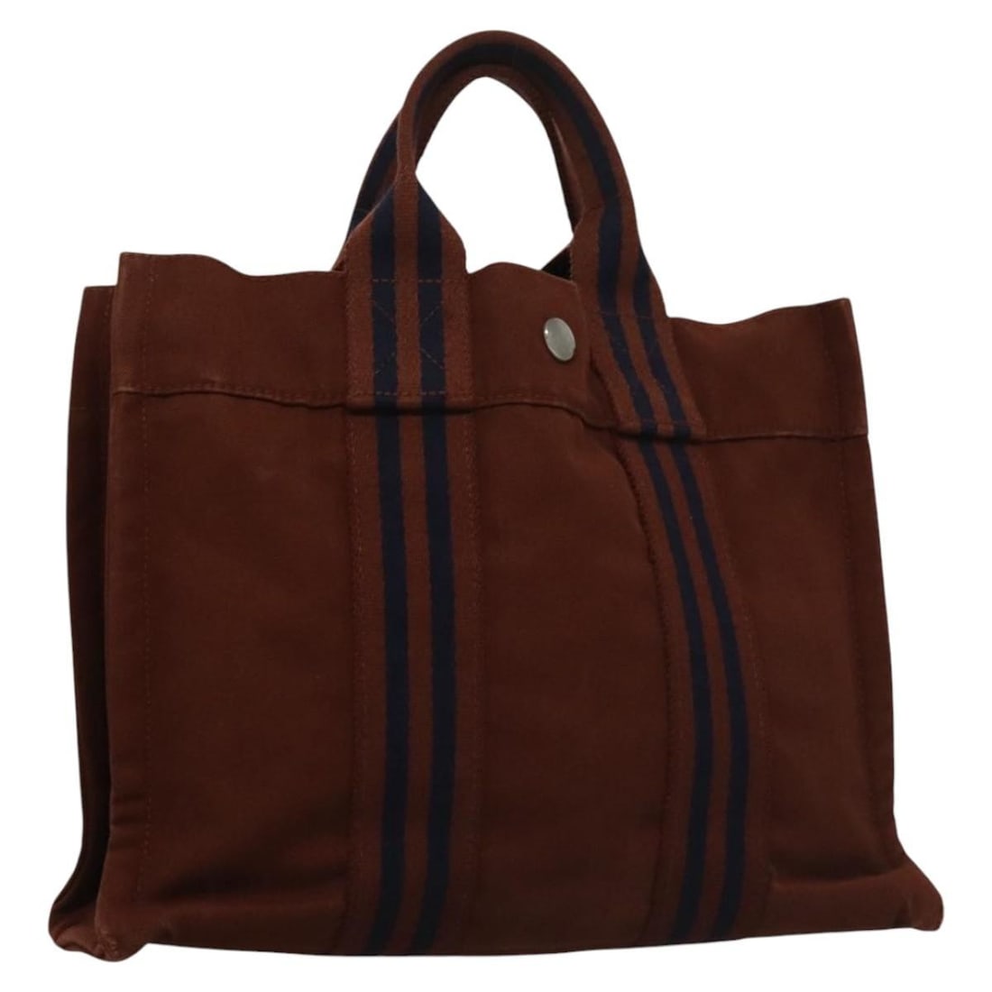 Brown Canvas Fourre Tout PM Tote by Hermes: Brown Canvas Fourre Tout PM Tote by Hermes This Hermes Fourre Tout PM handbag is crafted from brown canvas and designed for women. Made in France, it features a structured silhouette with dual handles