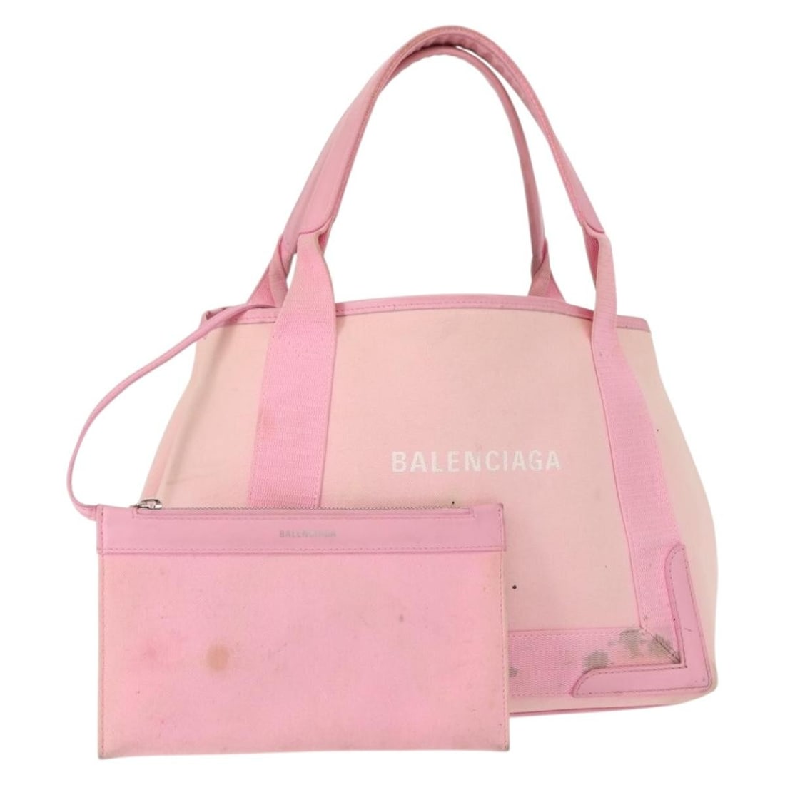 BALENCIAGA Cabas S Pink Canvas Hand Bag with Pouch: BALENCIAGA Cabas S Pink Canvas Hand Bag with Pouch This authentic BALENCIAGA Cabas S Hand Bag is crafted from durable canvas in a vibrant pink hue, making it a stylish accessory for any outfit. The ba