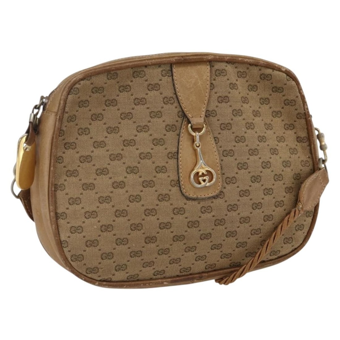 Beige Gold Micro GG Canvas Shoulder Bag by Gucci Italy: Beige Gold Micro GG Canvas Shoulder Bag by Gucci Italy This GUCCI Micro GG Canvas shoulder bag features a beige and gold color scheme with the signature micro GG canvas exterior. The bag is heavily us