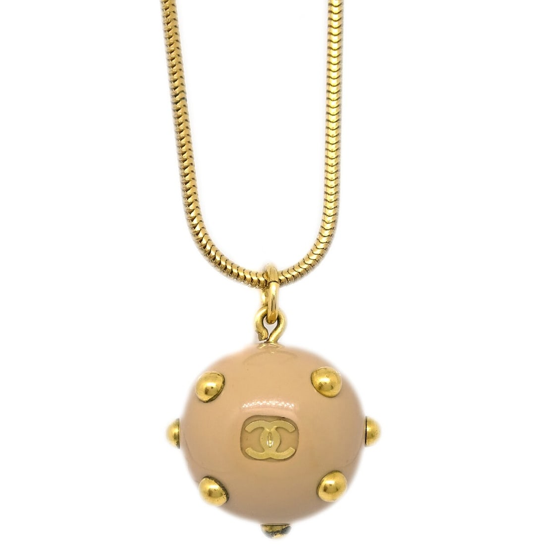 Chanel Gold-Plated Round Charm Pendant Necklace: Chanel Gold-Plated Round Charm Pendant Necklace Elevate your style with this exquisite Chanel Ball Pendant Necklace, featuring a charming round pendant in a beautiful gold beige color. This elegant ch