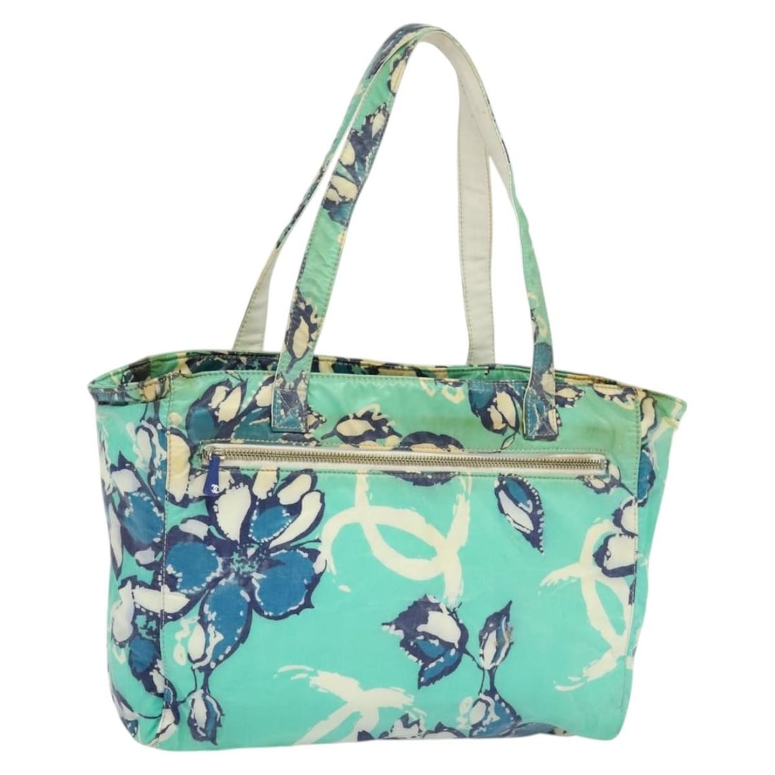 Green Nylon Tote with Silver CC Logo by CHANEL: Green Nylon Tote with Silver CC Logo by CHANEL This CHANEL tote bag is crafted from green and silver nylon and features silver-tone CC accents. Designed for women, it offers a spacious interior, makin