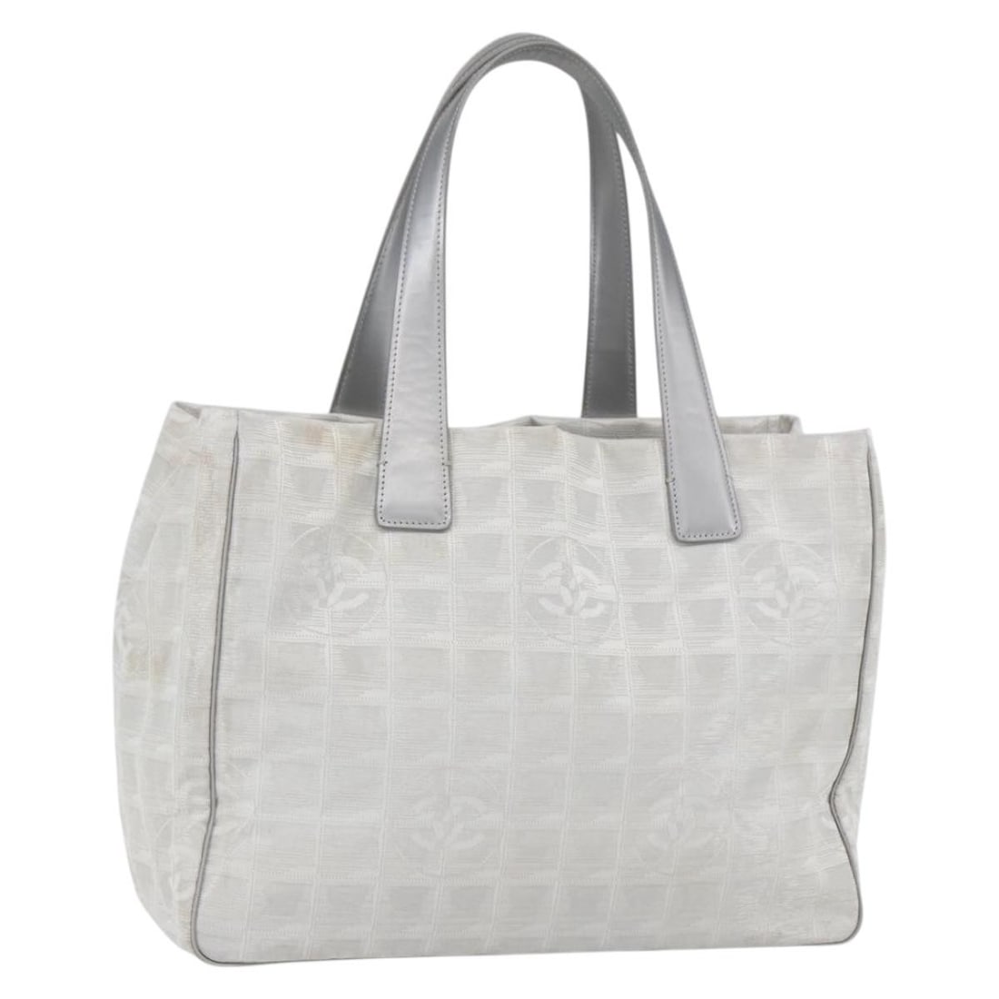 Chanel Silver Nylon New Travel Line Large Tote Bag from France: Chanel Silver Nylon New Travel Line Large Tote Bag from France This CHANEL Travel Line tote bag features a silver nylon exterior with the signature interlocking CC logo. Made in France, the tote offer