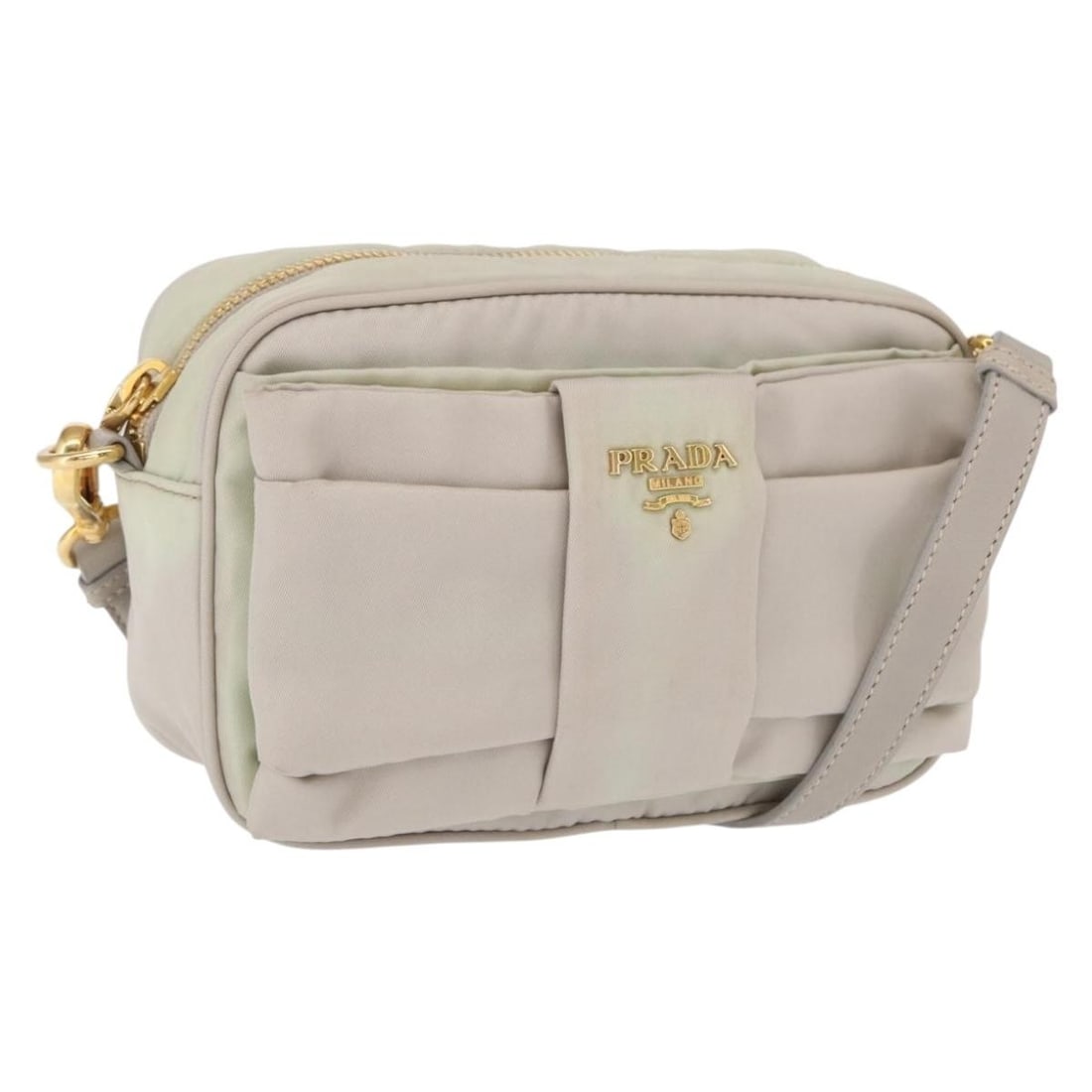Ivory and Gold Nylon PRADA Shoulder Bag Made in Italy: Ivory and Gold Nylon PRADA Shoulder Bag Made in Italy This PRADA shoulder bag is crafted from ivory and gold nylon and was made in Italy. The bag features a compact design with a shoulder strap and go