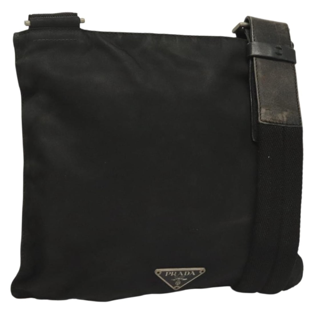 PRADA Black Silver Nylon Shoulder Bag Made in Italy: PRADA Black Silver Nylon Shoulder Bag Made in Italy This stylish PRADA shoulder bag is crafted from durable nylon in a sleek black and silver color combination. With a compact design, it measures appr