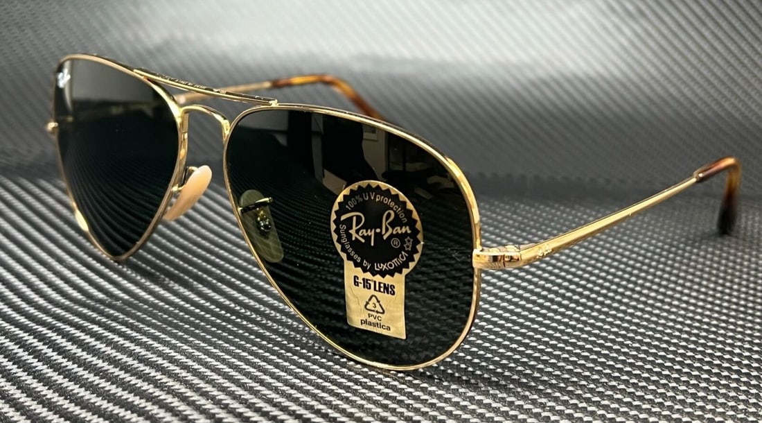 Ray-Ban RB3689 Gold Aviator Sunglasses G-15 Green Lenses: Ray-Ban RB3689 Gold Aviator Sunglasses G-15 Green Lenses Elevate your style with these Ray-Ban RB3689 Gold Aviator Sunglasses, a perfect blend of classic design and contemporary flair. Featuring a sol