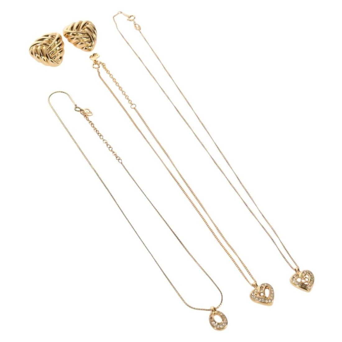 Christian Dior Gold Metal Earring 4 Piece Set Authentic: Christian Dior Gold Metal Earring 4 Piece Set Authentic This stunning set of Christian Dior earrings showcases exquisite craftsmanship in a classic gold metal finish. Designed for those who appreciate