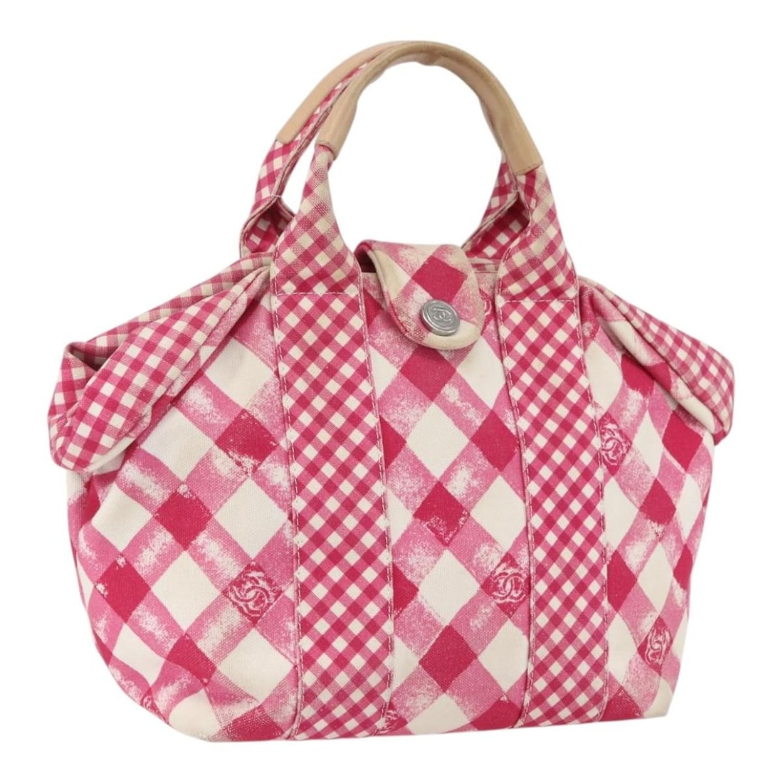 Pink Canvas CHANEL Cruise Line Handbag with Silver CC Italy: Pink Canvas CHANEL Cruise Line Handbag with Silver CC Italy This CHANEL Cruise Line handbag is crafted from pink and silver canvas and features the iconic CC logo. Made in Italy, it offers a structure