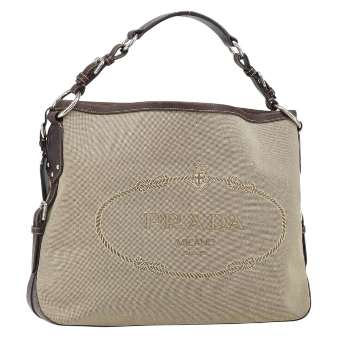 Prada Beige and Silver Canvas Leather Shoulder Bag with Accessories: Prada Beige and Silver Canvas Leather Shoulder Bag with Accessories This PRADA shoulder bag features a blend of leather and canvas in beige and silver tones. Designed for women, it offers a spacious i