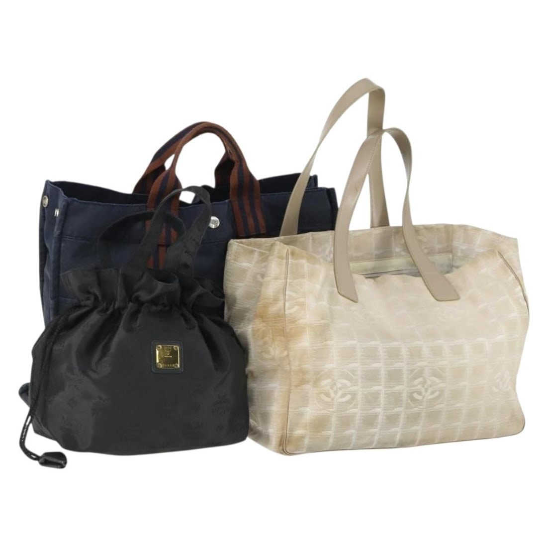 Set of 3 MCM Canvas Tote Bags in Beige Black and Navy: Set of 3 MCM Canvas Tote Bags in Beige Black and Navy This MCM tote bag set features three canvas bags in beige, black, and navy colors. The set is sold as depicted in the photos and does not include