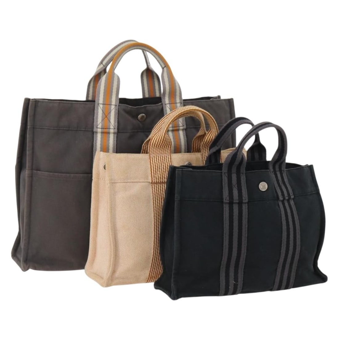Hermes Canvas Fourre Tout Handbag Three-Piece Set Orange Gray Black: Hermes Canvas Fourre Tout Handbag Three-Piece Set Orange Gray Black This is a set of three Hermes Fourre Tout handbags crafted from canvas in orange, gray, and black. Designed for women, these handbag