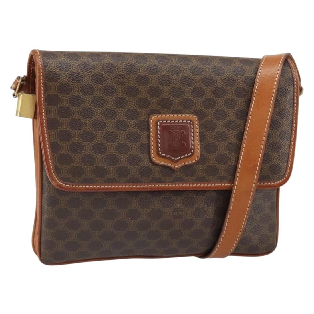 Celine Brown Macadam PVC Shoulder Bag Gold Accents: Celine Brown Macadam PVC Shoulder Bag Gold Accents This Celine Macadam shoulder bag features a brown and gold PVC leather exterior with the signature Macadam canvas design. Made in Italy, the bag offe