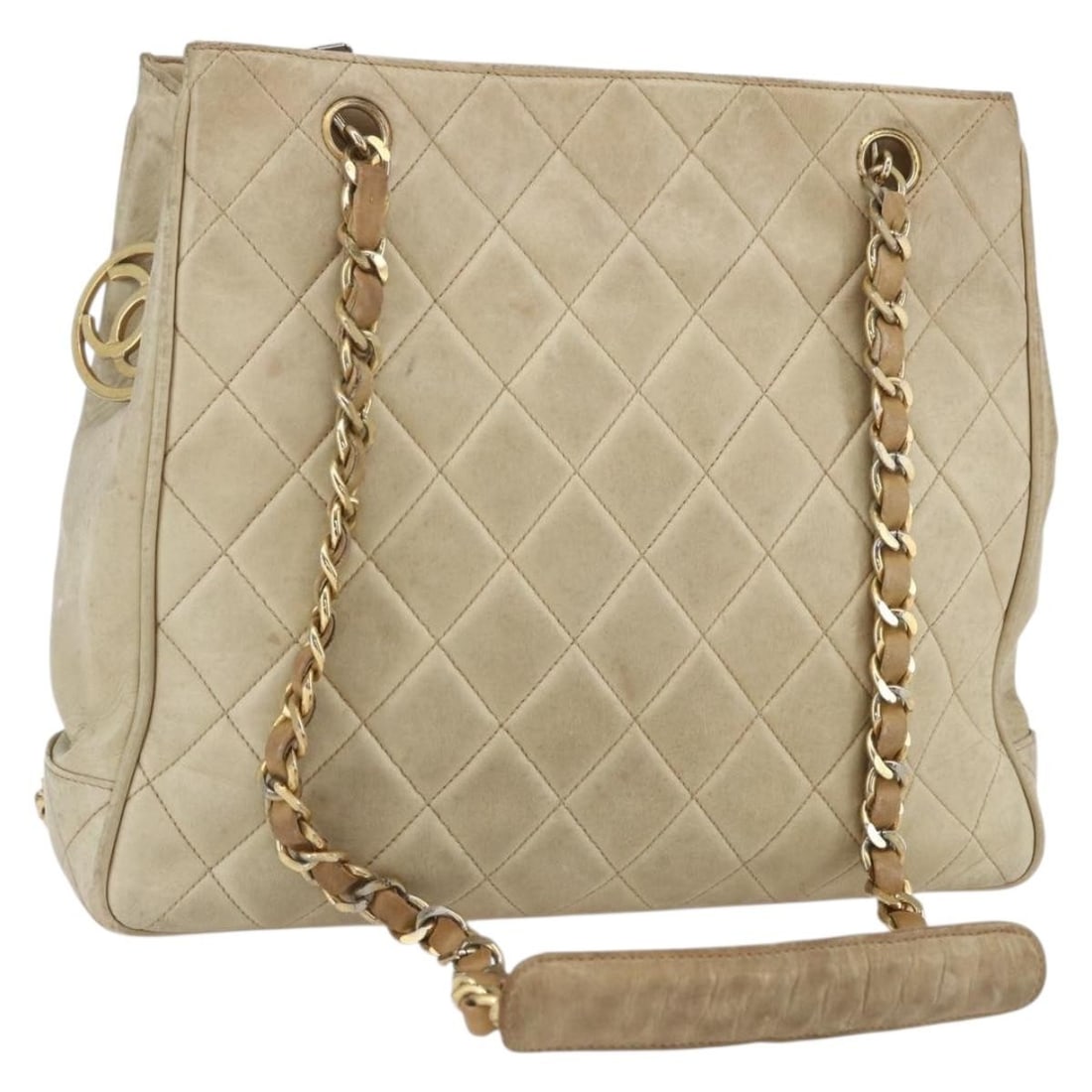 Beige Lambskin Matelasse Tote with Gold Chain by CHANEL: Beige Lambskin Matelasse Tote with Gold Chain by CHANEL This CHANEL Chain Matelasse tote bag is crafted from beige lambskin leather with gold-tone accents. It features a spacious interior, double hand