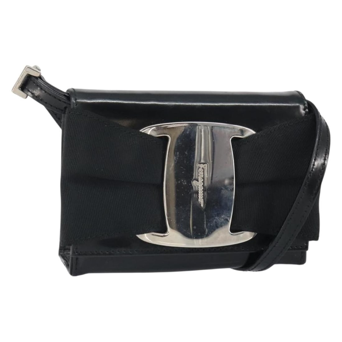 Black Patent Leather Vala Shoulder Bag by Salvatore Ferragamo Silver Hardware: Black Patent Leather Vala Shoulder Bag by Salvatore Ferragamo Silver Hardware This Salvatore Ferragamo Vala shoulder bag features black patent leather with silver-tone accents. The compact design incl