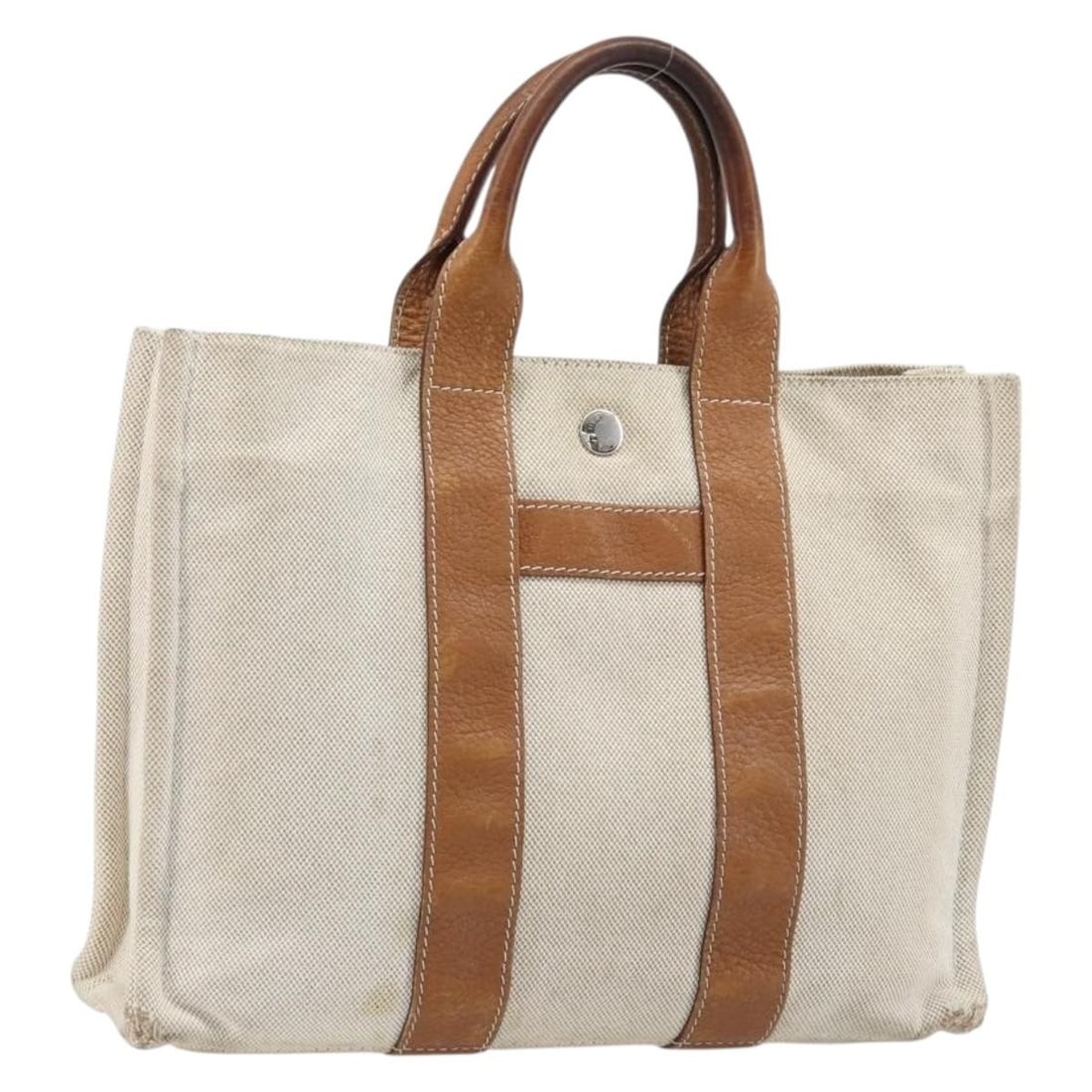 Hermes Arne PM Beige Canvas Women's Handbag Silver Tone Hardware: Hermes Arne PM Beige Canvas Women's Handbag Silver Tone Hardware This Hermes Sac Arne PM hand bag is crafted from beige canvas and features silver-tone accents. Designed for women, it offers a practic