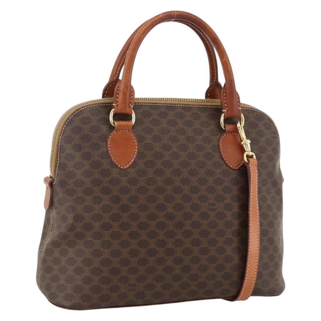 Celine Macadam Brown PVC Leather Two-Way Handbag with Shoulder Strap: Celine Macadam Brown PVC Leather Two-Way Handbag with Shoulder Strap This CELINE Macadam Canvas hand bag features a brown and gold design crafted from PVC leather and Macadam canvas. It offers versati