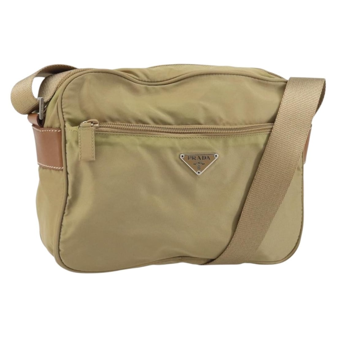 Beige Nylon Shoulder Purse by Prada with Silver Accents: Beige Nylon Shoulder Purse by Prada with Silver Accents This PRADA shoulder bag features a beige and silver nylon exterior and offers a practical, lightweight design. Made in Italy, the bag provides a