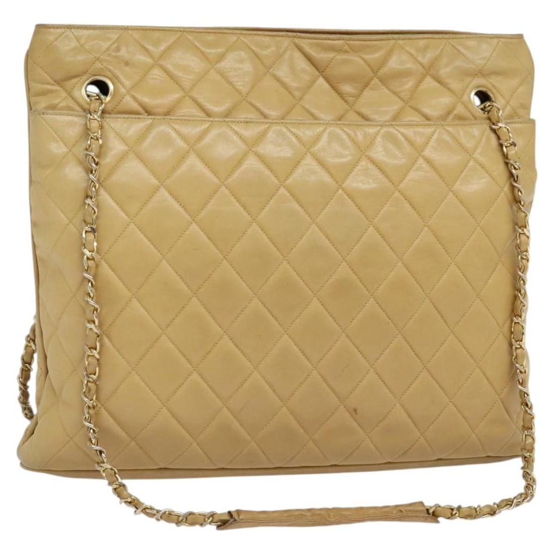 Chanel Beige Lambskin Matelasse Shoulder Bag with Gold Chain CC Logo: Chanel Beige Lambskin Matelasse Shoulder Bag with Gold Chain CC Logo This CHANEL Matelasse chain shoulder bag is crafted from lambskin leather in a beige and gold color scheme. Designed for women, it