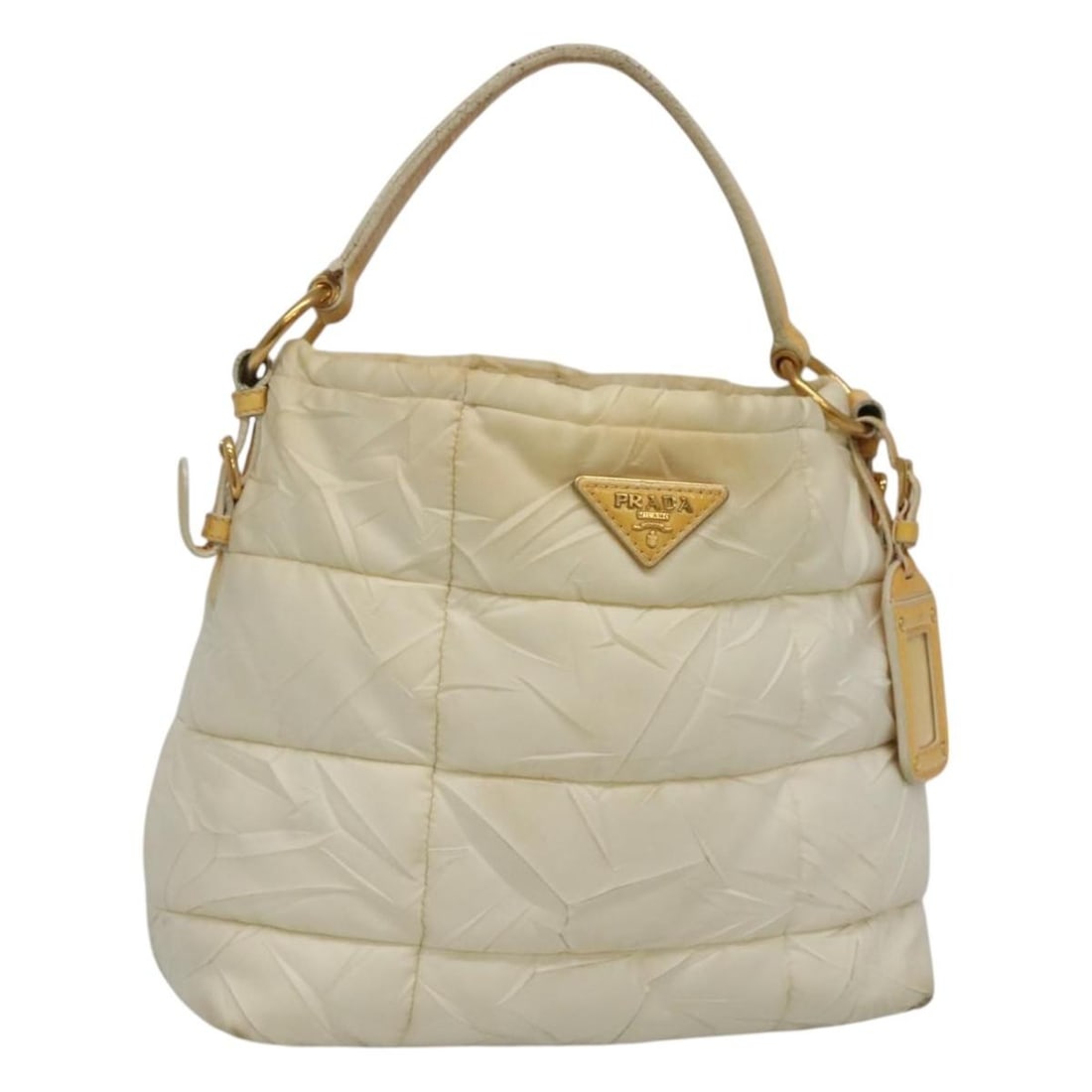 White and Gold Nylon Prada Handbag with Name Tag: White and Gold Nylon Prada Handbag with Name Tag This PRADA handbag is crafted from white and gold nylon, featuring a structured silhouette with dual handles and a name tag accessory. Designed for wom