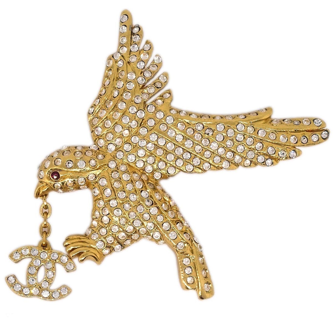 Gold Plated CHANEL 01P Eagle Brooch with Rhinestone Accent: Gold Plated CHANEL 01P Eagle Brooch with Rhinestone Accent This Chanel brooch features an elegant eagle motif adorned with sparkling rhinestones, set in a gold-plated finish. Crafted in France, it sho