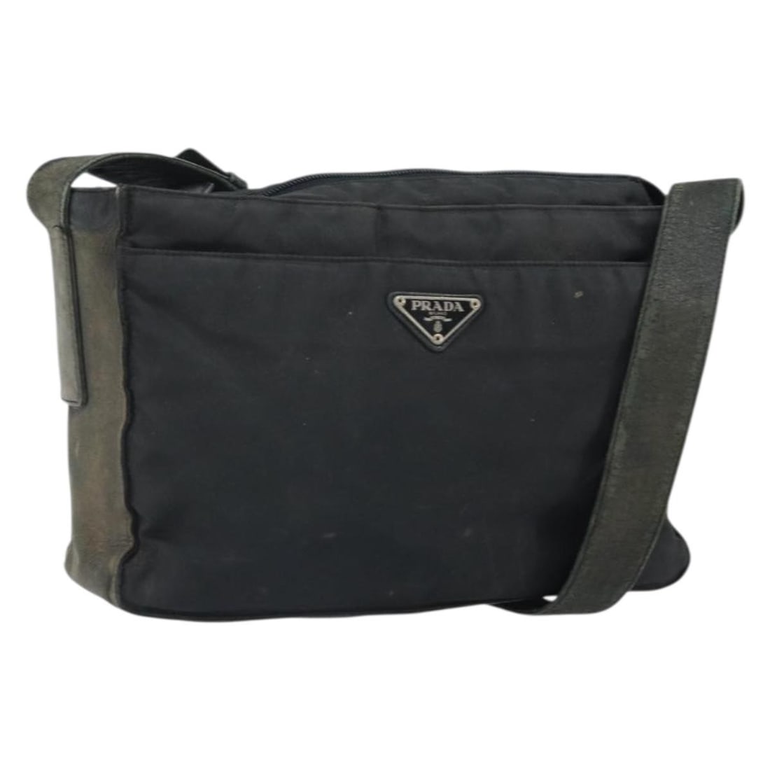 Black Nylon Shoulder Bag by Prada with Silver Tone Accents: Black Nylon Shoulder Bag by Prada with Silver Tone Accents This PRADA shoulder bag features a black nylon exterior with silver-tone accents. Designed for everyday use, it offers a practical silhouette
