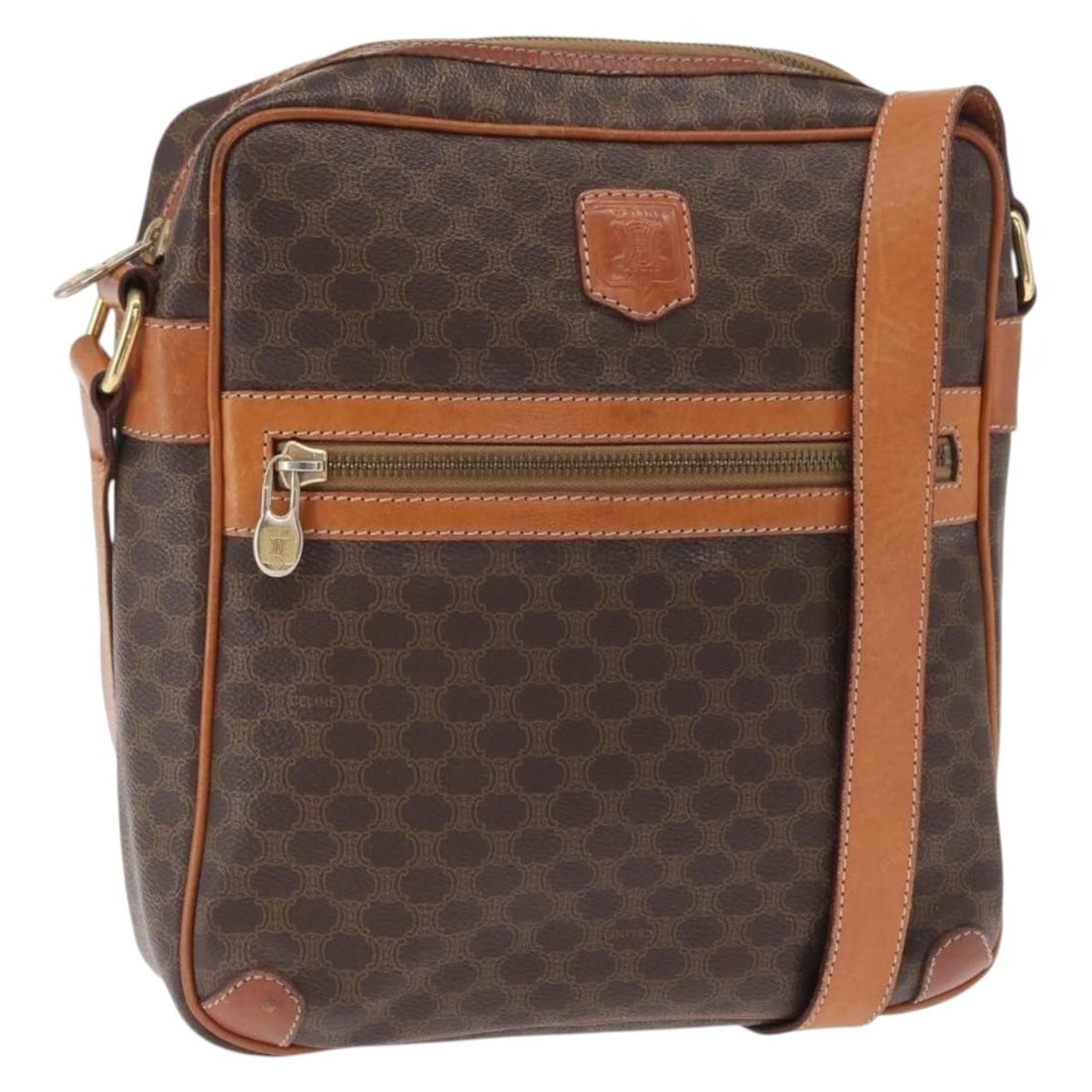 Celine Macadam Brown PVC Canvas Shoulder Bag with Gold Tone Accents: Celine Macadam Brown PVC Canvas Shoulder Bag with Gold Tone Accents This Celine shoulder bag features the signature Macadam canvas with PVC leather in brown and gold tones. The bag is made in Italy an