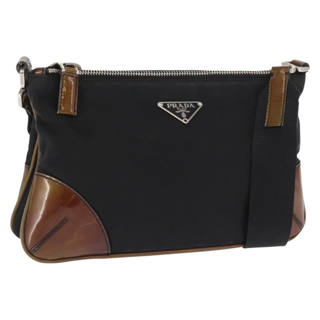 Black Nylon Shoulder Purse by Prada with Silver Accents: Black Nylon Shoulder Purse by Prada with Silver Accents This PRADA shoulder bag features a sleek design crafted from black nylon with silver-tone details. Made in Italy, the bag offers a compact silho