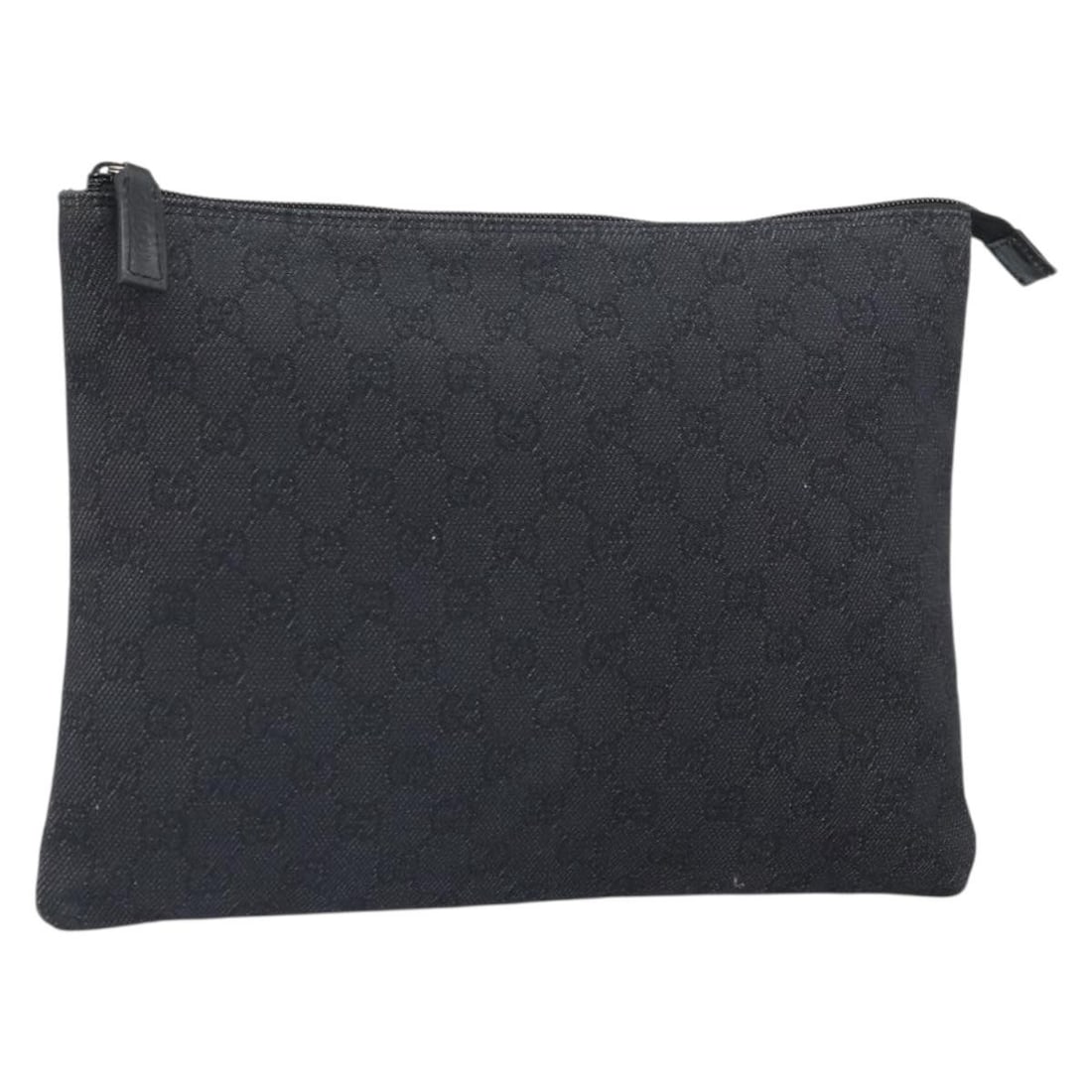 GG Canvas Black Silver Clutch by Gucci Model 105671: GG Canvas Black Silver Clutch by Gucci Model 105671 This GUCCI GG Canvas clutch bag features black and silver GG canvas exterior with silver-tone accents. Made in Italy, the bag offers a compact and s