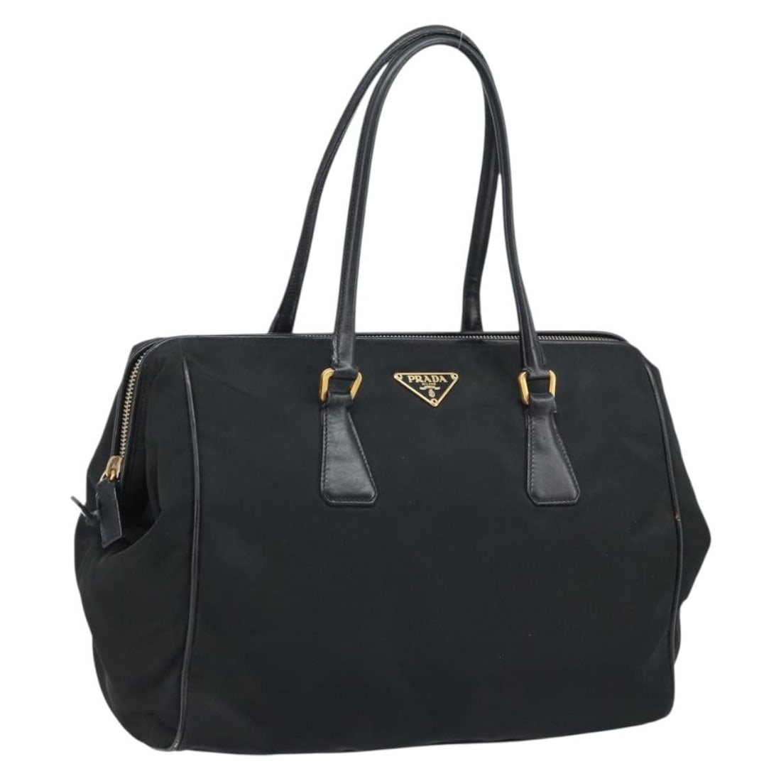 Prada Nylon Black and Gold Women's Handbag Made in Italy: Prada Nylon Black and Gold Women's Handbag Made in Italy This is a PRADA women's hand bag crafted from black nylon with gold-tone accents. The bag features a spacious interior and a classic silhouette