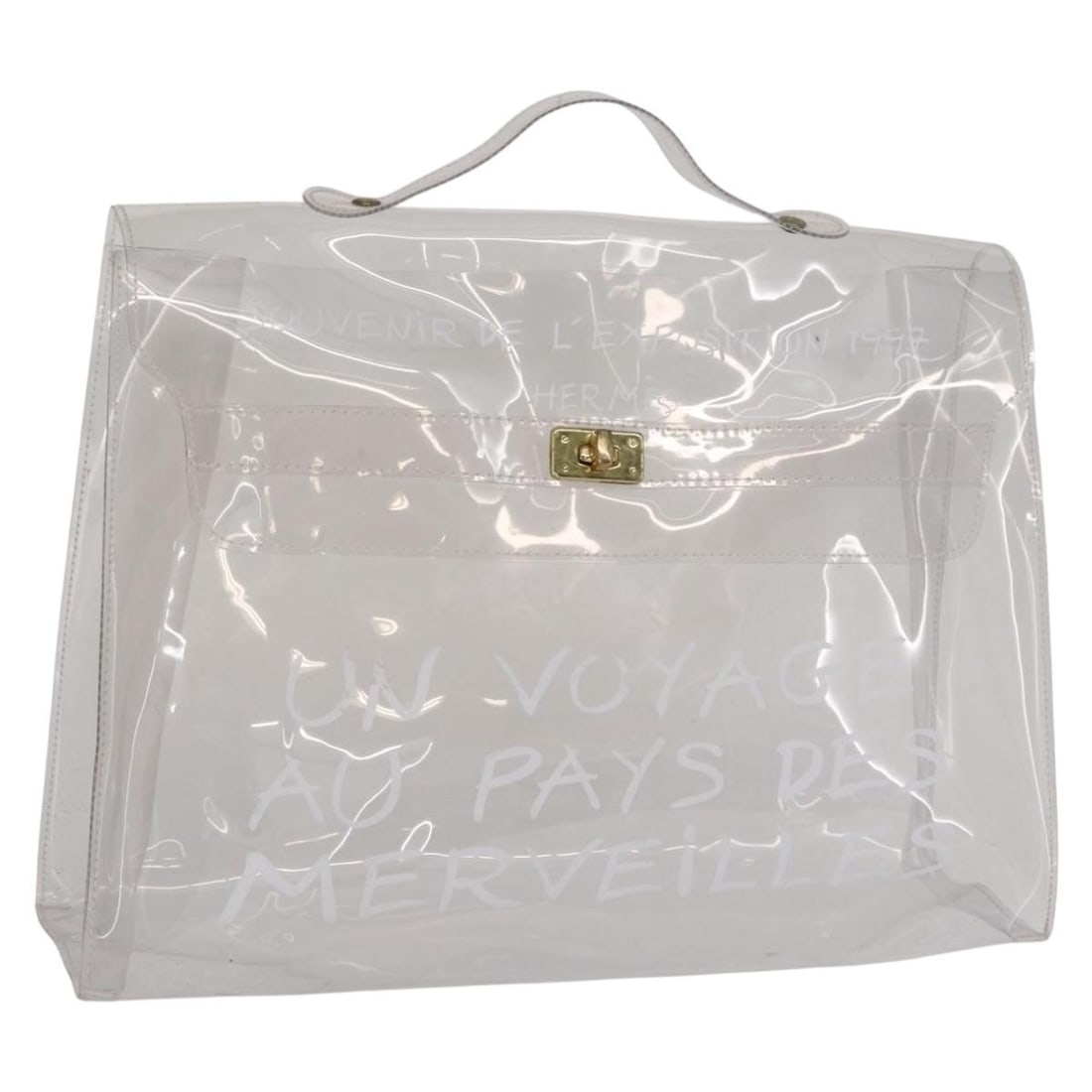 Clear Vinyl Kelly Handbag by Hermes France: Clear Vinyl Kelly Handbag by Hermes France This is an authentic Hermes Kelly hand bag crafted from clear vinyl. The bag features a structured silhouette with a top handle and a transparent design. It