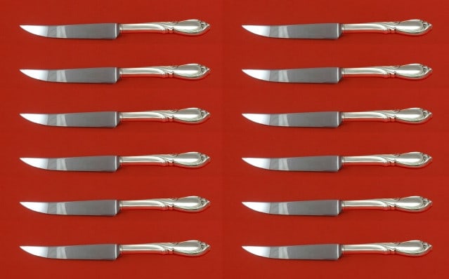 12pc Rhapsody New Sterling Silver Steak Knife Set by International: 12pc Rhapsody New Sterling Silver Steak Knife Set by International Enhance your dining experience with this exquisite set of 12 Rhapsody New steak knives by International Sterling. Crafted from high-q