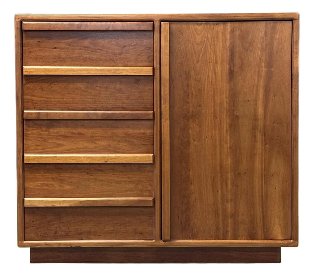 1980s Mid Century Modern Cherry Wood Armoire Dresser USA: 1980s Mid Century Modern Cherry Wood Armoire Dresser USA This stylish mid-century modern cherry armoire dresser from the 1980s is a perfect blend of form and function. It features ample drawer space a