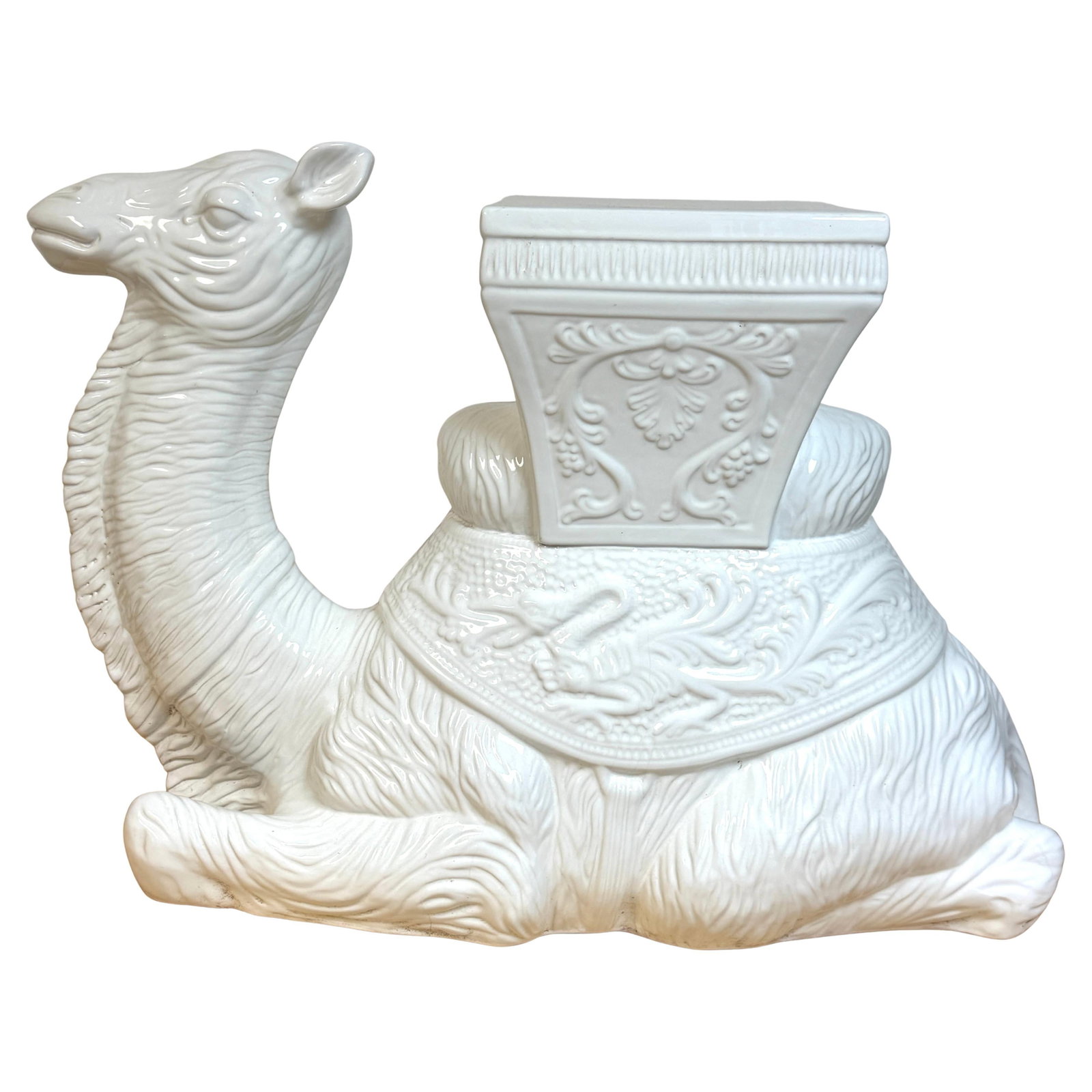 Porcelain Camel Form Hollywood Regency Italian Garden Seat or Accent Table 1970s: Porcelain Camel Form Hollywood Regency Italian Garden Seat or Accent Table 1970s This Italian Hollywood Regency Blanc de Chine garden seat or side table from the 1970s features a sculptural recumbent