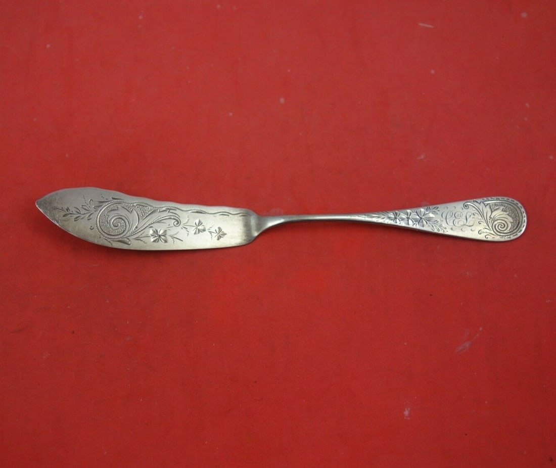 Whiting Sterling Silver Antique M-2 Engraved Master Butter Knife 7 1/8": Whiting Sterling Silver Antique M-2 Engraved Master Butter Knife 7 1/8" This exquisite Master Butter Knife features an Antique M-2 Engraved pattern by Whiting, showcasing the elegance of 19th-century