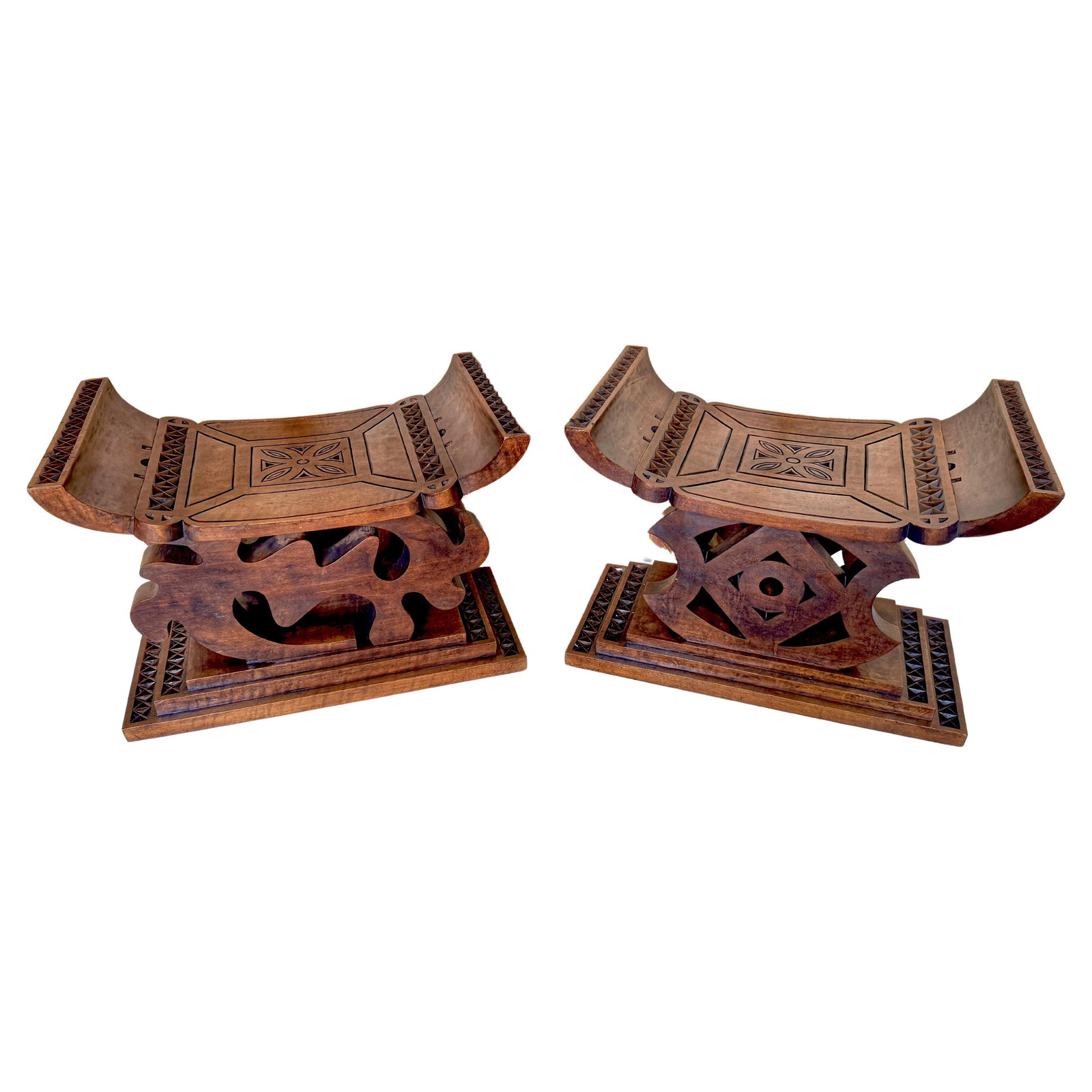 Set of 2 1960s Ghanaian Tribal Hand-Carved Hardwood Benches: Set of 2 1960s Ghanaian Tribal Hand-Carved Hardwood Benches Discover a unique pair of 1960s Carved Hardwood African Ghanaian Tribal Benches, each meticulously hand-carved and stained, showcasing the r