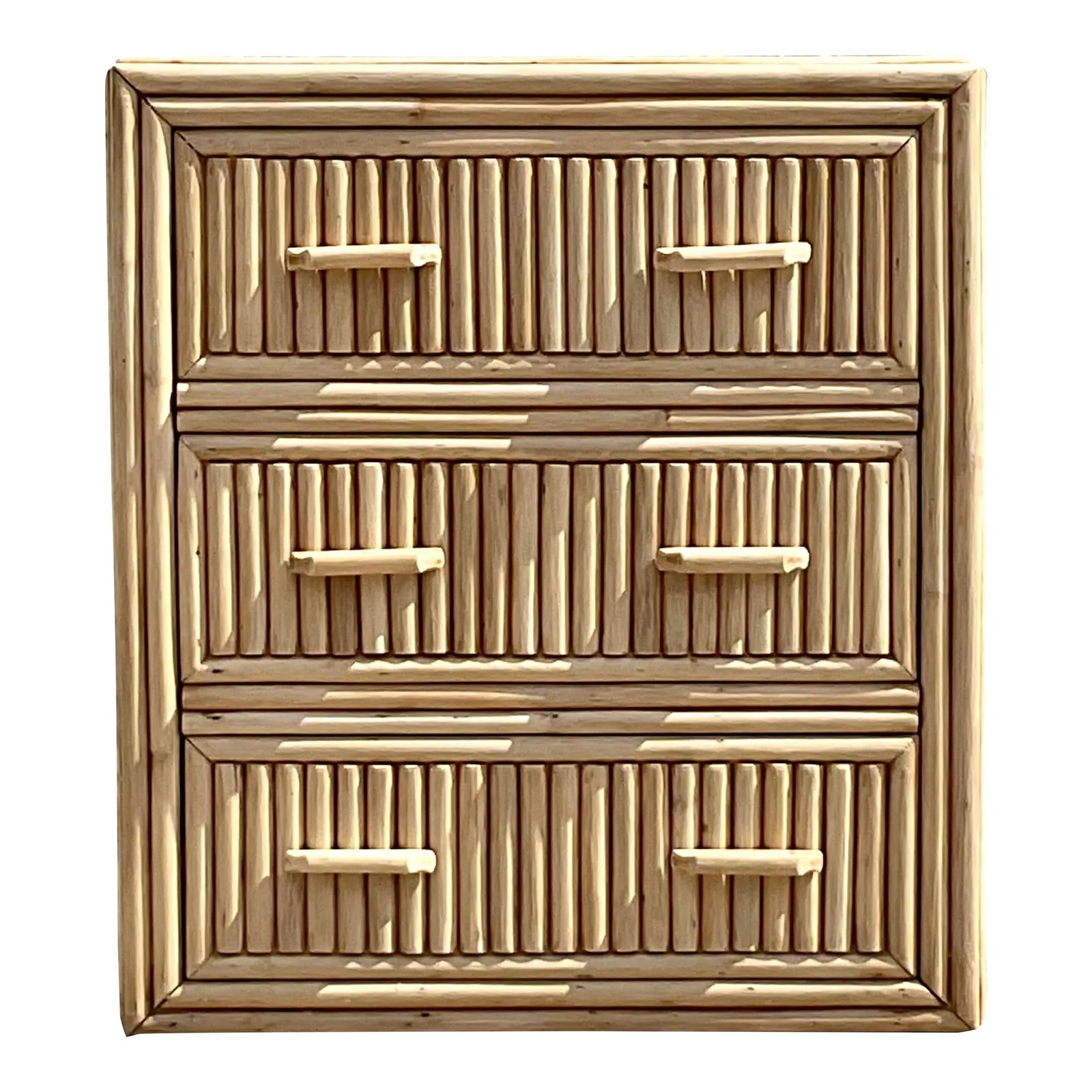 Coastal Vintage Bleached Rattan Chest of Drawers: Coastal Vintage Bleached Rattan Chest of Drawers Elevate your space with this Vintage Coastal Bleached Rattan Chest of Drawers, designed to bring a light and airy feel. The charming bleached rattan fi