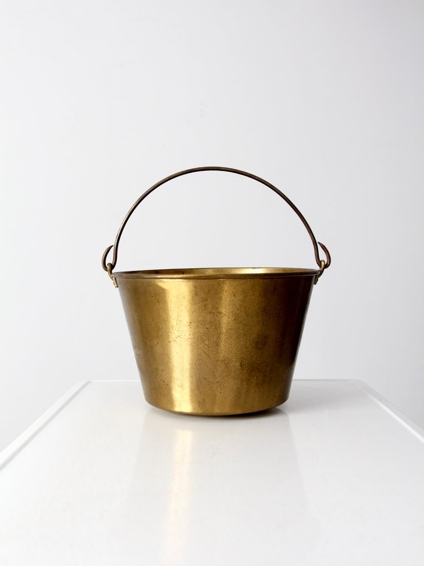 Brass Pail with Iron Handle by Ansonia Brass Company 1866 Patent: Brass Pail with Iron Handle by Ansonia Brass Company 1866 Patent This antique brass pail from the Ansonia Brass Company features a tapered profile, riveted handle attachments, and a softly worn brass