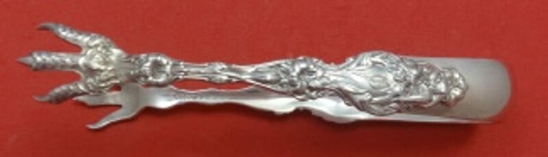 Whiting Lily Sterling Silver Sugar Tong 5 Inch Serving Piece: Whiting Lily Sterling Silver Sugar Tong 5 Inch Serving Piece This elegant sugar tong is crafted from high-quality sterling silver and features the exquisite "Lily" pattern by Whiting. Measuring 5 inch