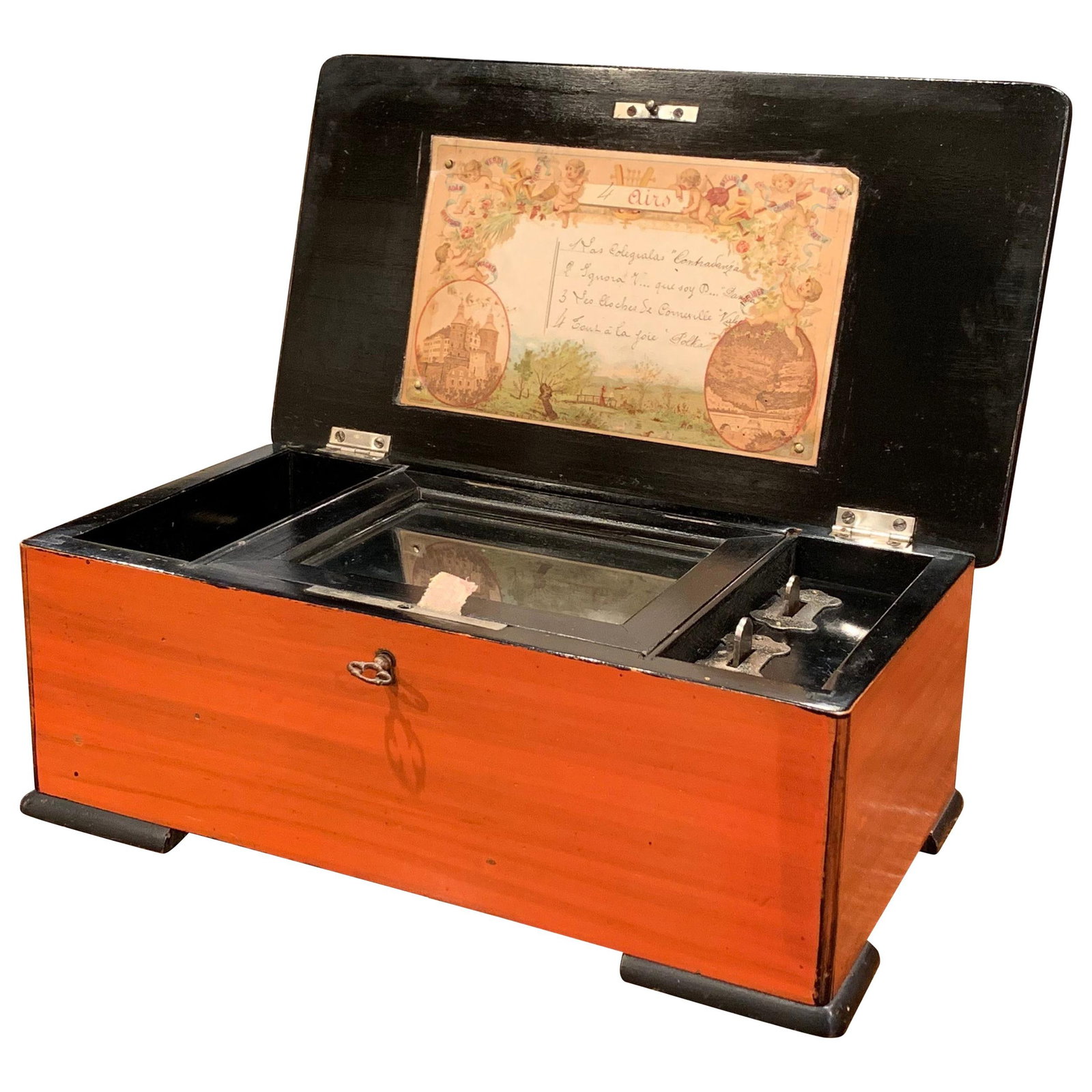 Antique 1900 French Tulip Wood Four-Song Music Box: Antique 1900 French Tulip Wood Four-Song Music Box This exquisite early 20th century French music box is a charming addition to any living space. Crafted around 1900 in Paris, its tulip wood construct