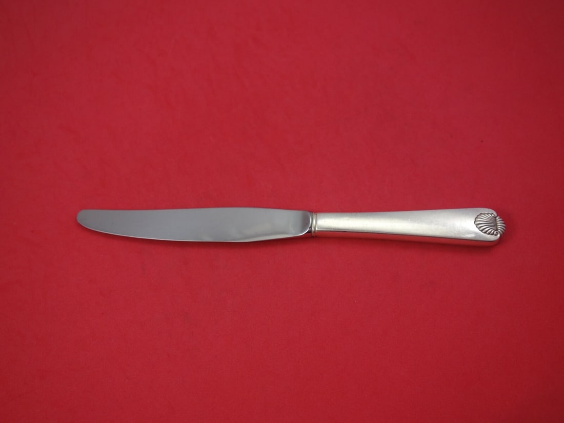 International Sterling Silver Colonial Shell Dinner Knife 9 7/8": International Sterling Silver Colonial Shell Dinner Knife 9 7/8" Experience elegant dining with this Colonial Shell dinner knife by International. Crafted from high-quality sterling silver, this knife