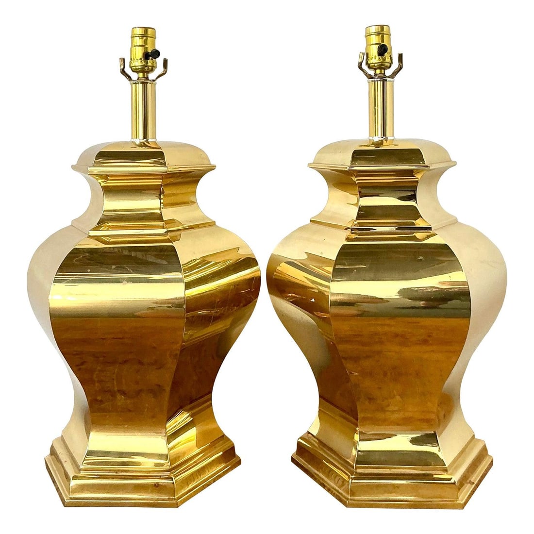 Pair of Faceted Brass Table Lamps with Geometric Octagonal Design: Pair of Faceted Brass Table Lamps with Geometric Octagonal Design This pair of vintage table lamps showcases a bold faceted silhouette and a high-polished brass finish, reflecting the Hollywood Regenc